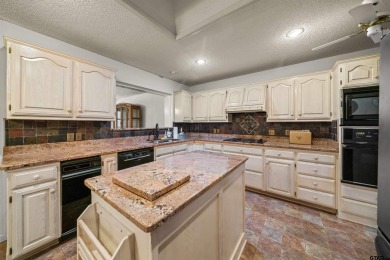 This property at Holly Lake Ranch offers a large covered front on Holly Lake Ranch Golf Club in Texas - for sale on GolfHomes.com, golf home, golf lot