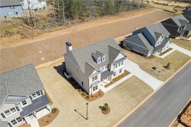 Nestled in the sought-after Traditions of Braselton community on Traditions of Braselton Golf Club in Georgia - for sale on GolfHomes.com, golf home, golf lot