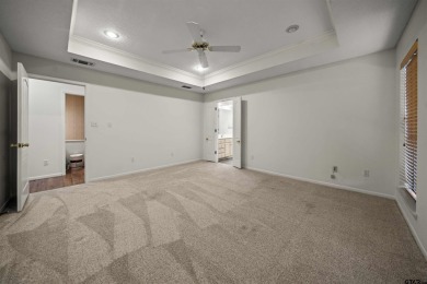 This property at Holly Lake Ranch offers a large covered front on Holly Lake Ranch Golf Club in Texas - for sale on GolfHomes.com, golf home, golf lot