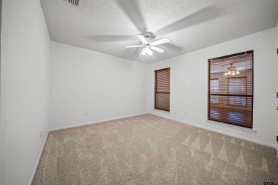 This property at Holly Lake Ranch offers a large covered front on Holly Lake Ranch Golf Club in Texas - for sale on GolfHomes.com, golf home, golf lot