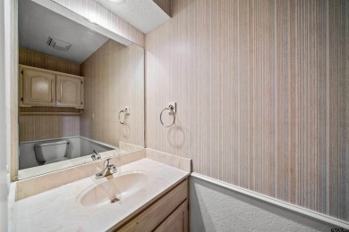 This property at Holly Lake Ranch offers a large covered front on Holly Lake Ranch Golf Club in Texas - for sale on GolfHomes.com, golf home, golf lot