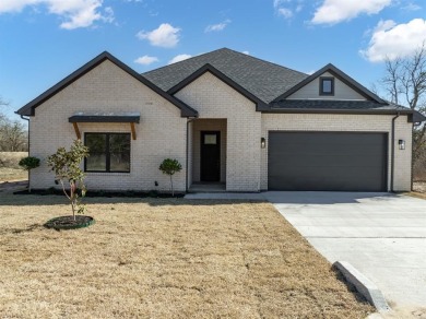 Luxury and tranquility in this 3 bedroom, 2.5 bath masterpiece on White Bluff Resort - New Course in Texas - for sale on GolfHomes.com, golf home, golf lot