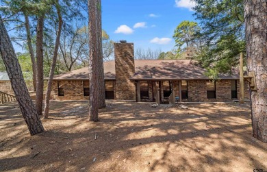 This property at Holly Lake Ranch offers a large covered front on Holly Lake Ranch Golf Club in Texas - for sale on GolfHomes.com, golf home, golf lot