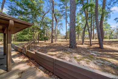 This property at Holly Lake Ranch offers a large covered front on Holly Lake Ranch Golf Club in Texas - for sale on GolfHomes.com, golf home, golf lot