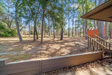 This property at Holly Lake Ranch offers a large covered front on Holly Lake Ranch Golf Club in Texas - for sale on GolfHomes.com, golf home, golf lot