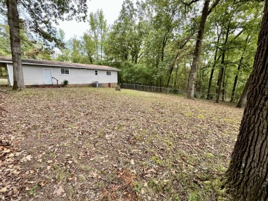 Nestled in the sought-after Diamondhead community, this on Diamondhead Golf and Country Club in Arkansas - for sale on GolfHomes.com, golf home, golf lot