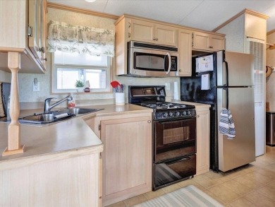 Welcome to this very cute and stylish 1-bedroom seasonal cottage on Apple Island Golf Course At Apple Island Resort in Vermont - for sale on GolfHomes.com, golf home, golf lot
