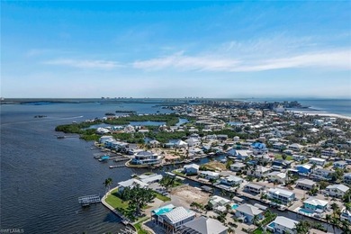 Coastal Waterfront Retreat with Panoramic Estero Bay Views & on Fort Myers Beach and Golf Club in Florida - for sale on GolfHomes.com, golf home, golf lot