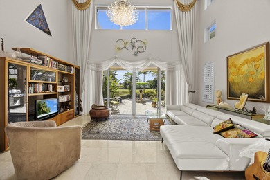 Spacious and living, situated on the 14th fairway of PGA's on PGA National Golf Club in Florida - for sale on GolfHomes.com, golf home, golf lot