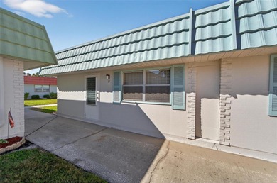 This bright condo features a living room-dining room combination on Sandpiper Golf Club in Florida - for sale on GolfHomes.com, golf home, golf lot
