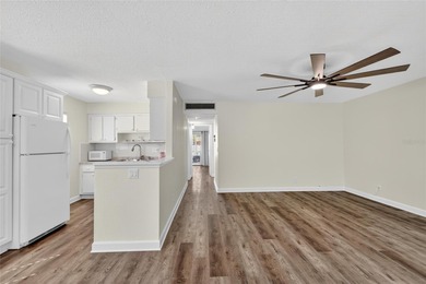 This bright condo features a living room-dining room combination on Sandpiper Golf Club in Florida - for sale on GolfHomes.com, golf home, golf lot