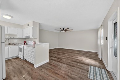 This bright condo features a living room-dining room combination on Sandpiper Golf Club in Florida - for sale on GolfHomes.com, golf home, golf lot