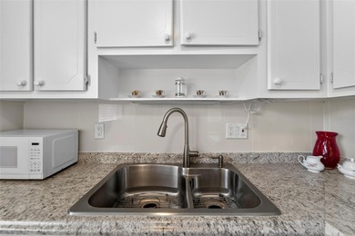 This bright condo features a living room-dining room combination on Sandpiper Golf Club in Florida - for sale on GolfHomes.com, golf home, golf lot