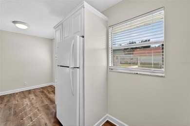 This bright condo features a living room-dining room combination on Sandpiper Golf Club in Florida - for sale on GolfHomes.com, golf home, golf lot