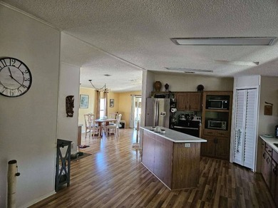 Discover your slice of paradise in this beautifully maintained on Sabal Springs Golf and Racquet Club in Florida - for sale on GolfHomes.com, golf home, golf lot