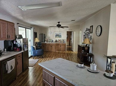 Discover your slice of paradise in this beautifully maintained on Sabal Springs Golf and Racquet Club in Florida - for sale on GolfHomes.com, golf home, golf lot