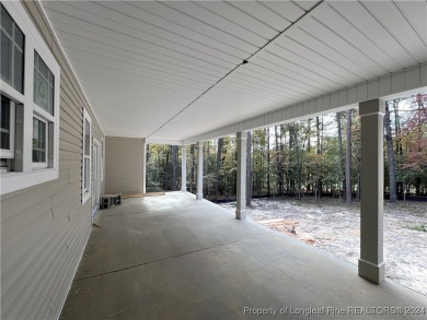 This is an exquisitely designed and beautifully constructed on Woodlake Country Club in North Carolina - for sale on GolfHomes.com, golf home, golf lot