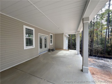 This is an exquisitely designed and beautifully constructed on Woodlake Country Club in North Carolina - for sale on GolfHomes.com, golf home, golf lot