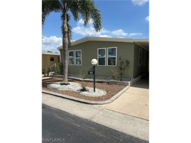 Beautifully renovated in 2024 this 2-bedroom 2 bath manufactured on Six Lakes Country Club in Florida - for sale on GolfHomes.com, golf home, golf lot