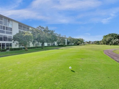 Just reduced. Pristine second floor condo in the gated community on Wynmoor Golf Course in Florida - for sale on GolfHomes.com, golf home, golf lot