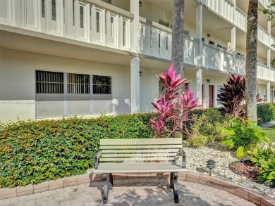 Just reduced. Pristine second floor condo in the gated community on Wynmoor Golf Course in Florida - for sale on GolfHomes.com, golf home, golf lot
