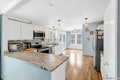 Effortless lakefront living meets income potential--welcome to on Tanglewood Shores Golf Club in Virginia - for sale on GolfHomes.com, golf home, golf lot