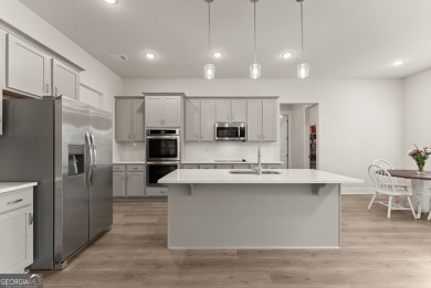 Discover luxury living in this barely lived-in gem nestled in on Traditions of Braselton Golf Club in Georgia - for sale on GolfHomes.com, golf home, golf lot