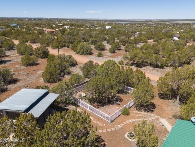 Truly one-of-a-kind home with lake rights in the highly on Juniper Ridge R.V. Golf Resort in Arizona - for sale on GolfHomes.com, golf home, golf lot