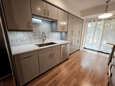 Experience refined living in this beautifully updated 2-bedroom on Old Orchard Country Club in Illinois - for sale on GolfHomes.com, golf home, golf lot