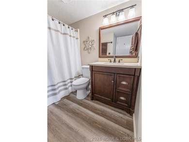 Neighboring Margaritaville Lake Resort, this property delivers on The Oaks Golf Course in Missouri - for sale on GolfHomes.com, golf home, golf lot