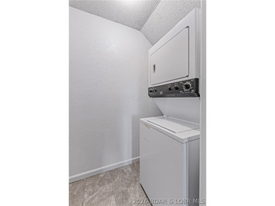 Neighboring Margaritaville Lake Resort, this property delivers on The Oaks Golf Course in Missouri - for sale on GolfHomes.com, golf home, golf lot