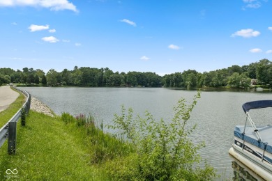 Nestled on the tranquil shores of a private lake, this elegant on Foxcliff Golf Club in Indiana - for sale on GolfHomes.com, golf home, golf lot
