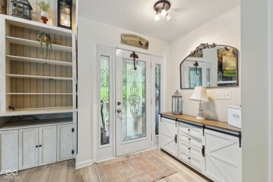 Nestled on the tranquil shores of a private lake, this elegant on Foxcliff Golf Club in Indiana - for sale on GolfHomes.com, golf home, golf lot