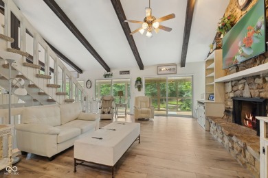 Nestled on the tranquil shores of a private lake, this elegant on Foxcliff Golf Club in Indiana - for sale on GolfHomes.com, golf home, golf lot
