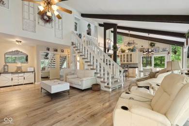 Nestled on the tranquil shores of a private lake, this elegant on Foxcliff Golf Club in Indiana - for sale on GolfHomes.com, golf home, golf lot