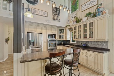 Nestled on the tranquil shores of a private lake, this elegant on Foxcliff Golf Club in Indiana - for sale on GolfHomes.com, golf home, golf lot