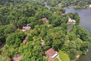 Nestled on the tranquil shores of a private lake, this elegant on Foxcliff Golf Club in Indiana - for sale on GolfHomes.com, golf home, golf lot