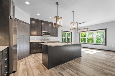 This lovely one-of-a-kind, brand new townhome is a beauty on Cherry Hills Golf Course in Wisconsin - for sale on GolfHomes.com, golf home, golf lot