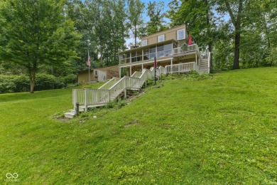 Nestled on the tranquil shores of a private lake, this elegant on Foxcliff Golf Club in Indiana - for sale on GolfHomes.com, golf home, golf lot