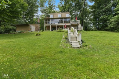Nestled on the tranquil shores of a private lake, this elegant on Foxcliff Golf Club in Indiana - for sale on GolfHomes.com, golf home, golf lot