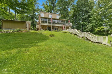 Nestled on the tranquil shores of a private lake, this elegant on Foxcliff Golf Club in Indiana - for sale on GolfHomes.com, golf home, golf lot