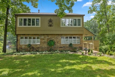 Nestled on the tranquil shores of a private lake, this elegant on Foxcliff Golf Club in Indiana - for sale on GolfHomes.com, golf home, golf lot