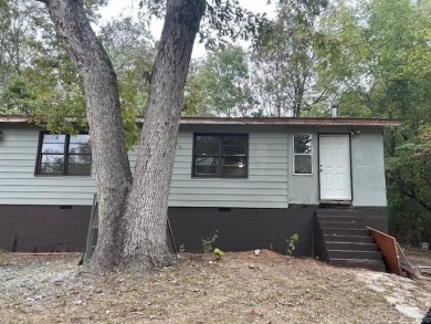 Remodel opportunity: Charming 3-bedroom, 2-bath ranch-style home on Cherokee Village North Course in Arkansas - for sale on GolfHomes.com, golf home, golf lot
