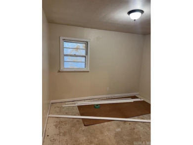 Remodel opportunity: Charming 3-bedroom, 2-bath ranch-style home on Cherokee Village North Course in Arkansas - for sale on GolfHomes.com, golf home, golf lot