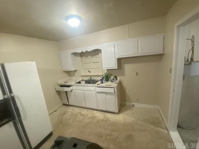 Remodel opportunity: Charming 3-bedroom, 2-bath ranch-style home on Cherokee Village North Course in Arkansas - for sale on GolfHomes.com, golf home, golf lot