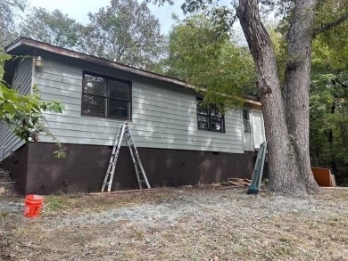 Remodel opportunity: Charming 3-bedroom, 2-bath ranch-style home on Cherokee Village North Course in Arkansas - for sale on GolfHomes.com, golf home, golf lot