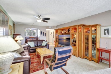 Beautiful 3/2 condo with serene lake and golf course views in on Pine Island Ridge Country Club in Florida - for sale on GolfHomes.com, golf home, golf lot