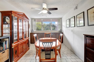 Beautiful 3/2 condo with serene lake and golf course views in on Pine Island Ridge Country Club in Florida - for sale on GolfHomes.com, golf home, golf lot