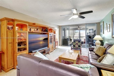 Beautiful 3/2 condo with serene lake and golf course views in on Pine Island Ridge Country Club in Florida - for sale on GolfHomes.com, golf home, golf lot