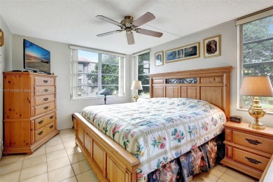 Beautiful 3/2 condo with serene lake and golf course views in on Pine Island Ridge Country Club in Florida - for sale on GolfHomes.com, golf home, golf lot